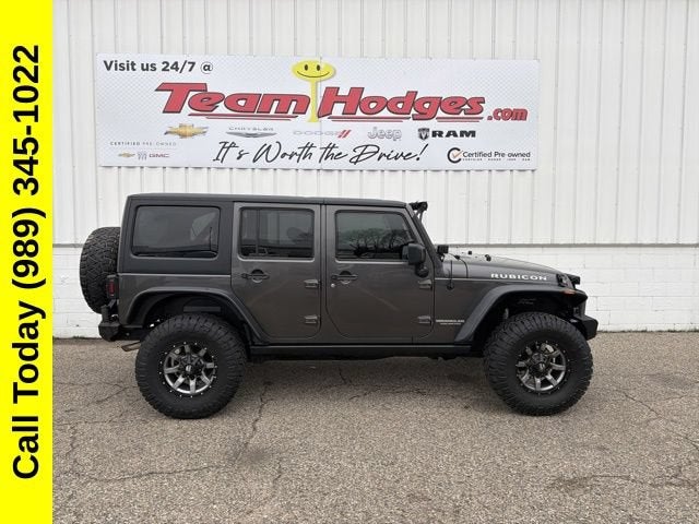 2014 Jeep Wrangler Unlimited Rubicon in None — front three-quarter view