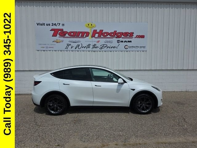 2023 Tesla Model Y Long Range in White — front three-quarter view